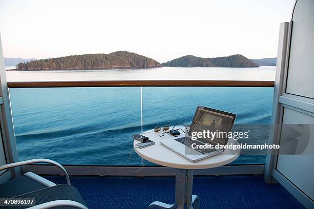 view from cruise ship with laptop on table, alaska, usa - alaska cruise stock pictures, royalty-free photos & images