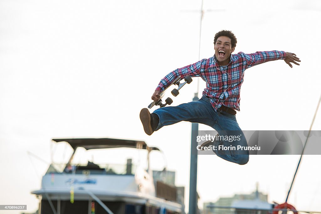 Skateboarder leaping for joy