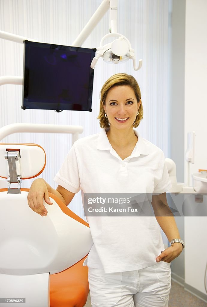 Portrait of female dentist in clinic