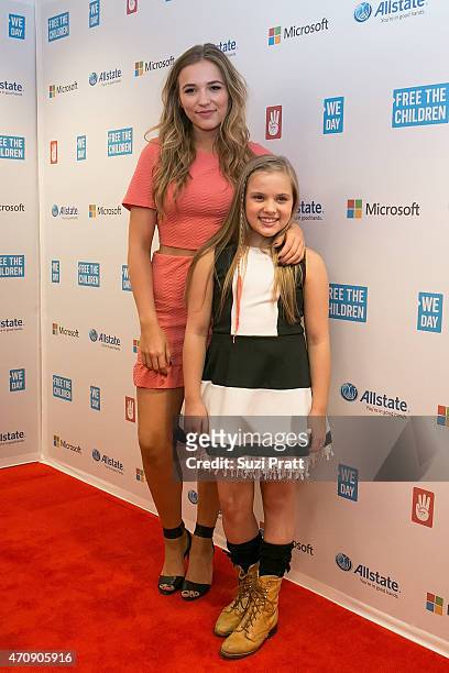 Actresses and musicians Lennon Stella and Maisy Stella pose for a photo at We Day at KeyArena on April 23, 2015 in Seattle, Washington.