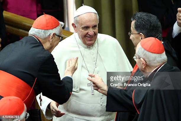 Pope Francis greets cardinals as he arrives at the Synod Hall for the morning session of Extraordinary Consistory on the themes of Family on February...