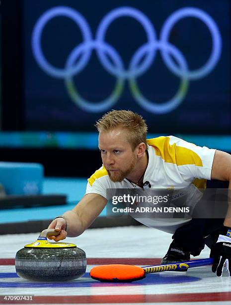 Sweden's Skip Niklas Edin throws a stone during the men's Bronze medal match between Sweden and China at the Ice Cube curling centre in Sochi on...