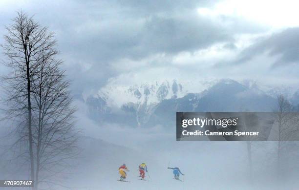 Anna Holmlund of Sweden, Stephanie Joffroy of Chile and Katrin Ofner of Austria compete in heavy fog in the Freestyle Skiing Womens' Ski Cross...