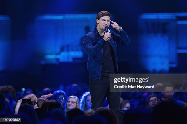 Actor Luke Bilyk speaks on stage during We Day at KeyArena on April 23, 2015 in Seattle, Washington.