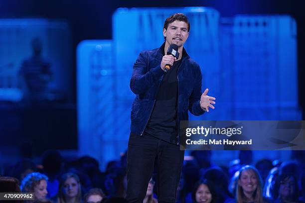 Actor Luke Bilyk speaks on stage during We Day at KeyArena on April 23, 2015 in Seattle, Washington.