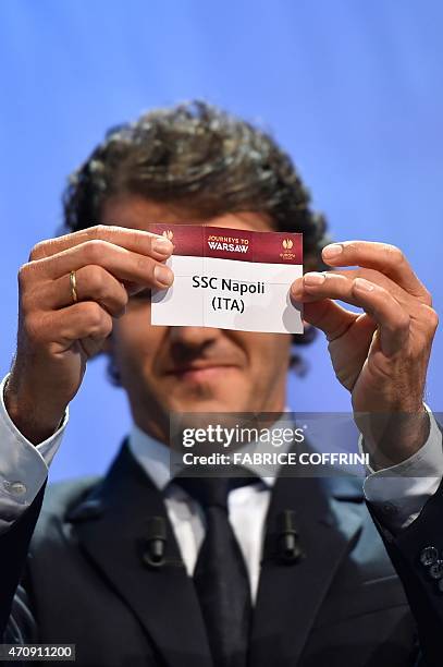 The ambassador for the UEFA Champions League final in Berlin Karl-Heinz Riedle shows the name of Napoli during the draw for the UEFA Europa League...