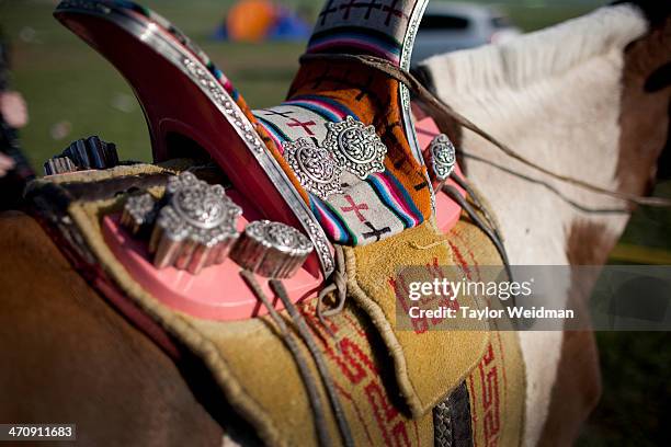 An intricately designed Mongolian saddle with silver decorations. Mongolian pastoral herders make up one of the world's largest remaining nomadic...