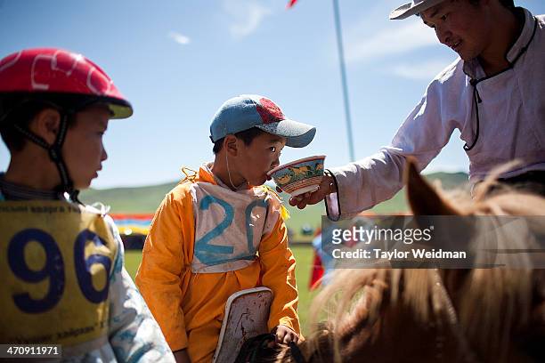 Young jockeys prepare for races by drinking airag . Mongolian pastoral herders make up one of the world's largest remaining nomadic cultures. For...