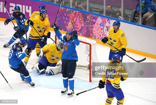 Olli Jokinen of Finland celebrates after scoring in the second period against Henrik Lundqvist of Sweden during the Men's Ice Hockey Semifinal...