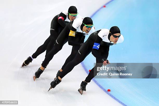 Mathieu Giroux, Lucas Makowsky, Denny Morrison of Canada compete during the Men's Team Pursuit Quarterfinals Speed Skating event on day fourteen of...