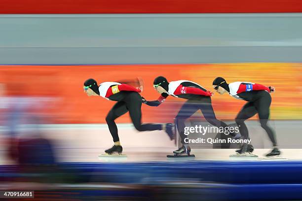 Lucas Makowsky, Mathieu Giroux and Denny Morrison of Canada compete during the Men's Team Pursuit Quarterfinals Speed Skating event on day fourteen...