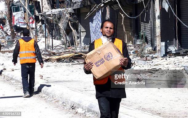 United Nations states that food supplies are distributed in Yarmouk Palestinian Refugee Camp after 11 days in Damascus, Syria on February 18, 2014.
