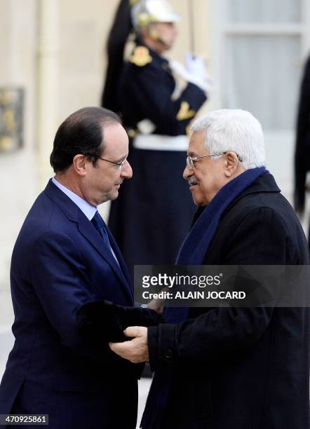 French President Francois Hollande shakes hands with Palestinian President Mahmud Abbas, on February 21 at the Elysee Palace in Paris. Ideas proposed...