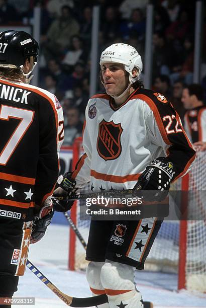 Rick Tocchet of the Wales Conference and the Pittsburgh Penguins talks with Jeremy Roenick of the Campbell Conference and the Chicago Blackhawks...