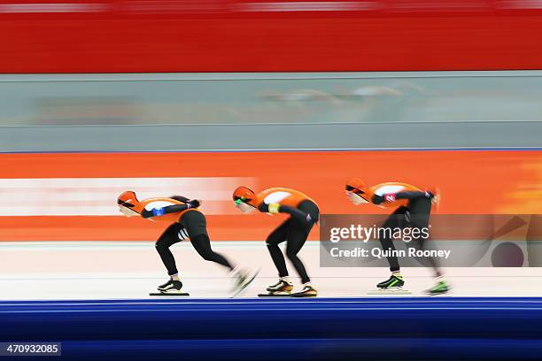 Ireen Wust, Lotte van Beek and Jorien ter Mors of the Netherlands compete during the Women's Team Pursuit Quarterfinals Speed Skating event on day...