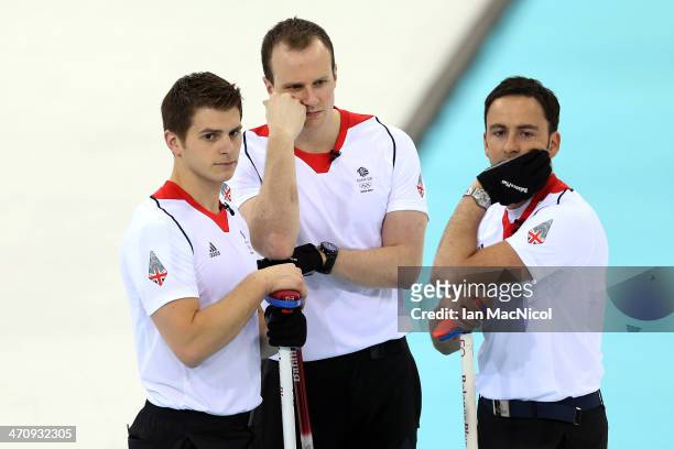 The Great Britain Rink of Scott Andrew, Micheal Goodfellow and David Murdoch look dejected during the Men's Gold medal match between Great Britain...