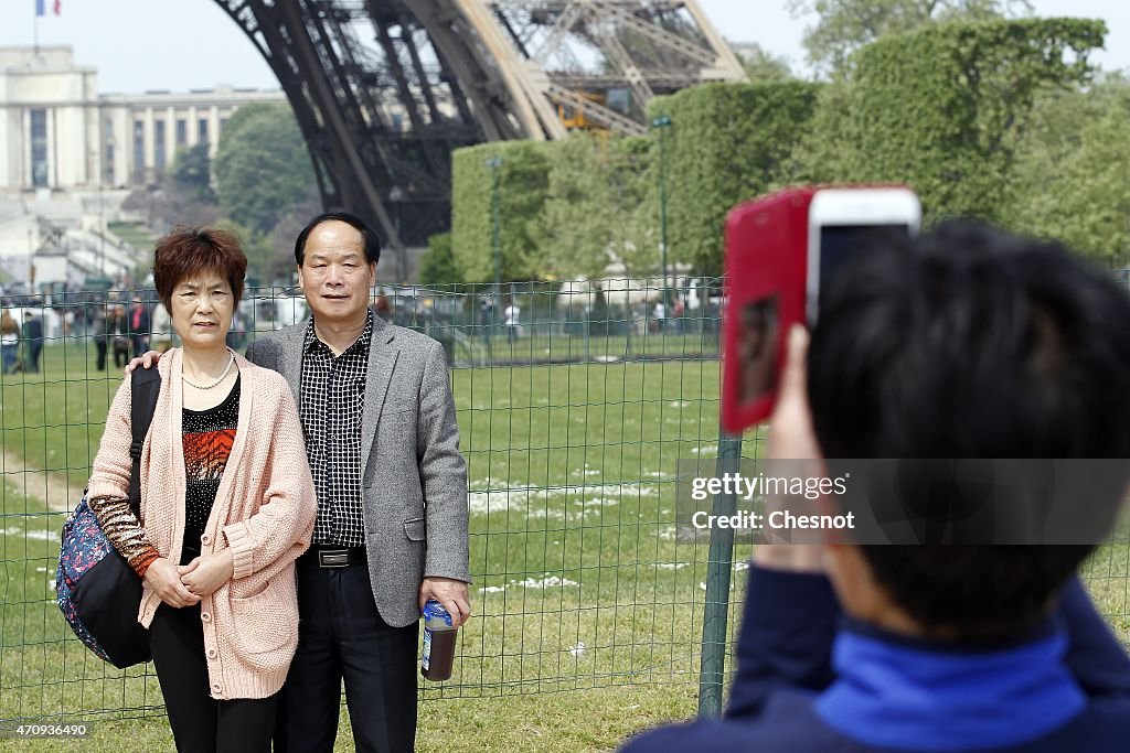 Tourists Visit Eiffel Tower