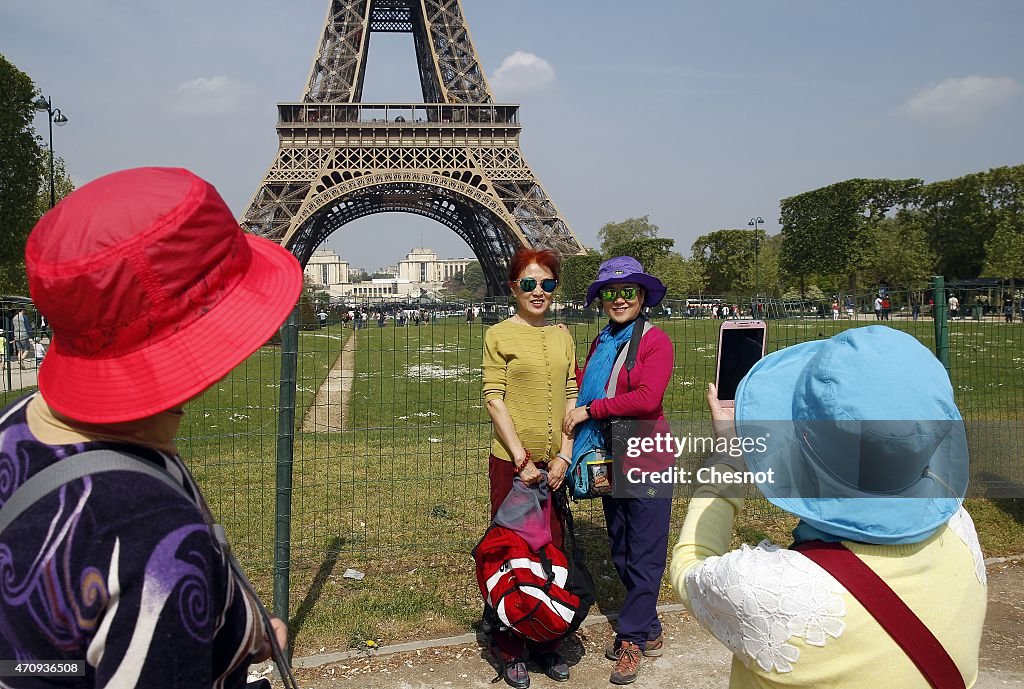 Tourists Visit Eiffel Tower