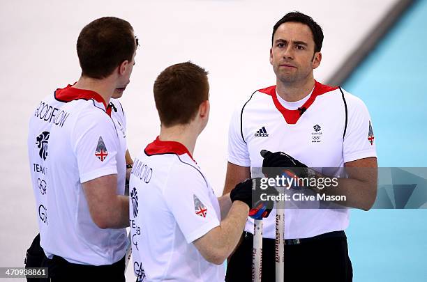 Michael Goodfellow, Scott Andrews, Greg Drummond and David Murdoch of Great Britain look thoughtful during the Men's Gold Medal match between Canada...