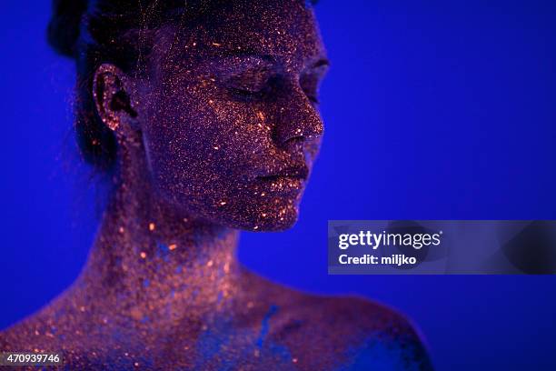portrait painted with fluorescent makeup under the ultraviolet l - body art stock pictures, royalty-free photos & images