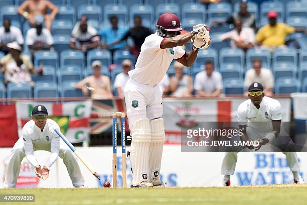 West Indies cricketer Devon Smith is bowled by England's bowler James Anderson during day four of the second Test cricket match between the West...