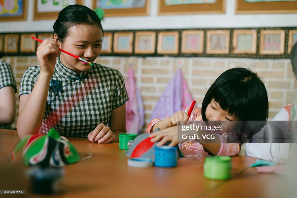 Kindergarten Teachers Wear Cheongsam In School