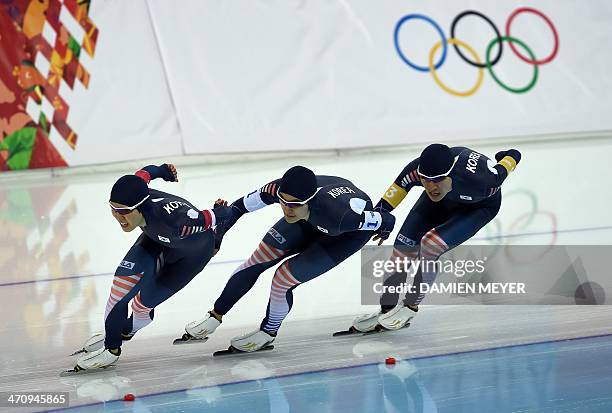 South Korea's Kim Cheol-Min, Joo Hyong-Jun, and Lee Seung-Hoon compete in the Men's Speed Skating Team Pursuit Semifinals at the Adler Arena during...