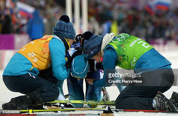 Olena Pidhrushna of Ukraine celebrates the gold medal with Valj Semerenko and Juliya Dzhyma in the Women's 4 x 6 km Relay during day 14 of the Sochi...