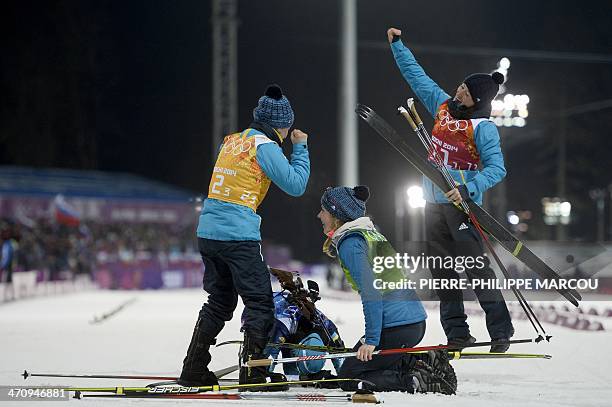 Gold medalists Ukraine's Valj Semerenko, Olena Pidhrushna, Juliya Dzhyma and Vita Semerenko celebrate their win in the Women's Biathlon 4x6 km Relay...