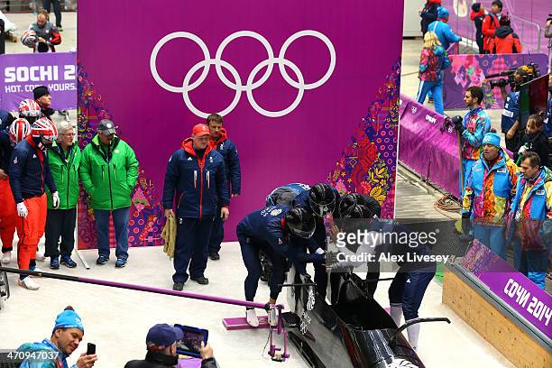 John Jackson, Stuart Benson, Bruce Tasker and Joel Fearon of Great Britain prepare to start during a four-man bobsleigh practice session on Day 14 of...