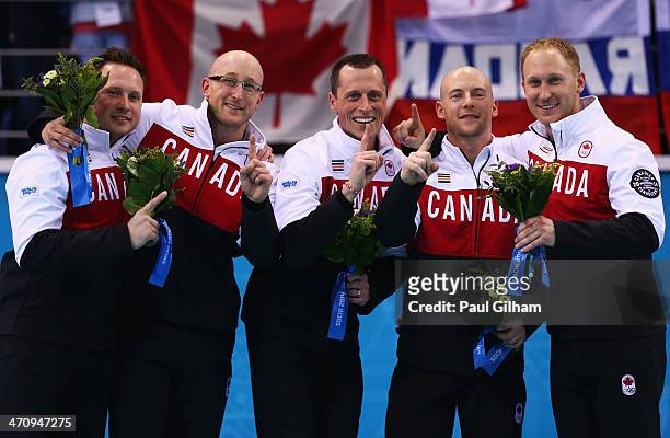 Gold medalists Caleb Flaxey, Ryan Harnden, EJ Harnden, Ryan Fry and Brad Jacobs of Canada celebrate during the flower ceremony for the Men's Gold...