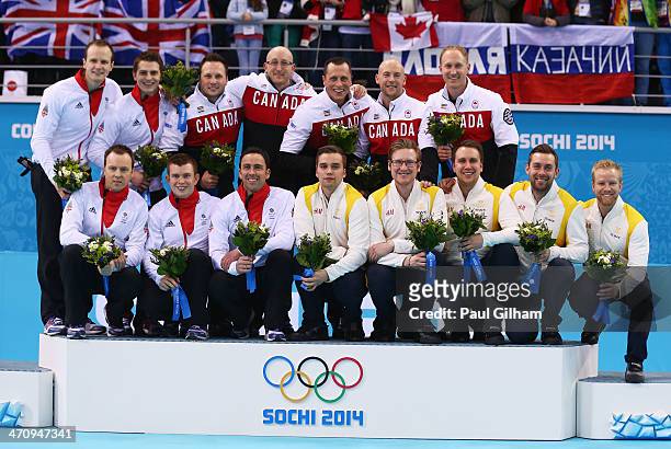 Silver medalists Great Britain, gold medalists Canada and bronze medalists Sweden pose during the flower ceremony after the Men's Gold Medal match...