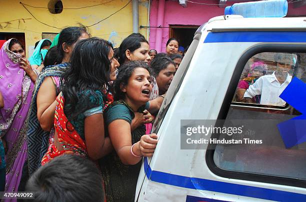 Mother veils after the death of her 16-year-old daughter, who set herself afire at her house at Vijay Nagar on April 24, 2015 in Ghaziabad, India. On...