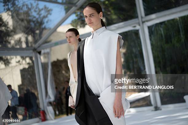 Models present creations by German designer Christina Braun during the 30th edition of the International Festival of Fashion and Photography on April...
