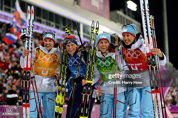 Bronze medalists Ann Kristin Aafedt Flatland, Tora Berger, Tiril Eckhoff and Fanny Welle-Strand Horn of Norway celebrate during the flower ceremony...