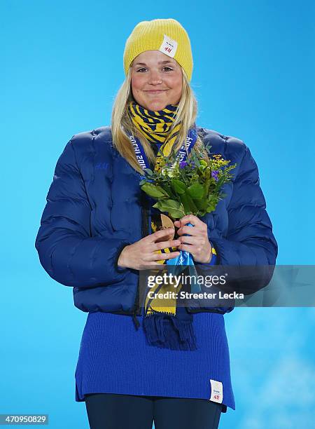 Bronze medalist Anna Holmlund of Sweden celebrates during the medal ceremony for the Women's Ski Cross on day fourteen of the Sochi 2014 Winter...