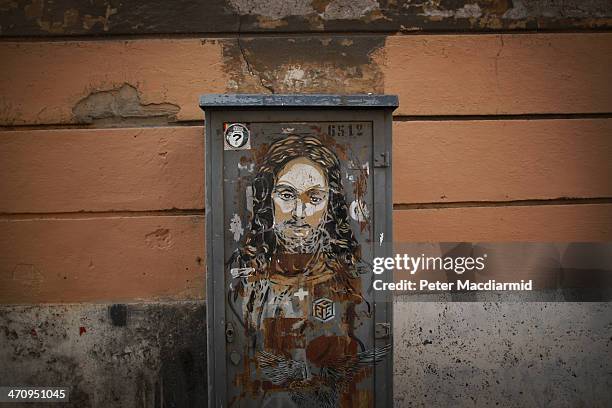 Graffiti image of Jesus is seen on a communications cabinet in the street on February 21, 2014 in Rome, Italy. Pope Francis will create 19 new...