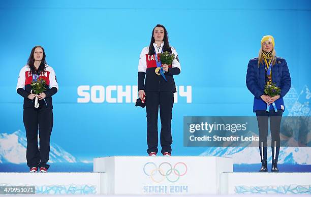 Silver medalist Kelsey Serwa of Canada, gold medallist Marielle Thompson of Canada and bronze medalist Anna Holmlund of Sweden celebrate during the...