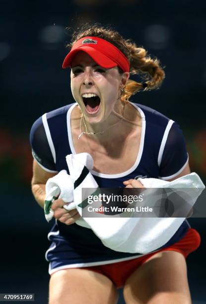 Alize Cornet of France celebrates beating Serena Williams of the USA during the semi finals of the WTA Dubai Duty Free Tennis Championship at the...