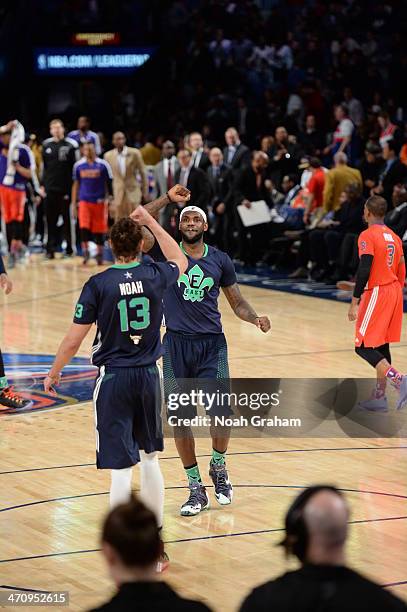 LeBron James of the Eastern Conference high five Joakim Noah during the game against the Western Conference during the 2014 NBA All-Star Game at...