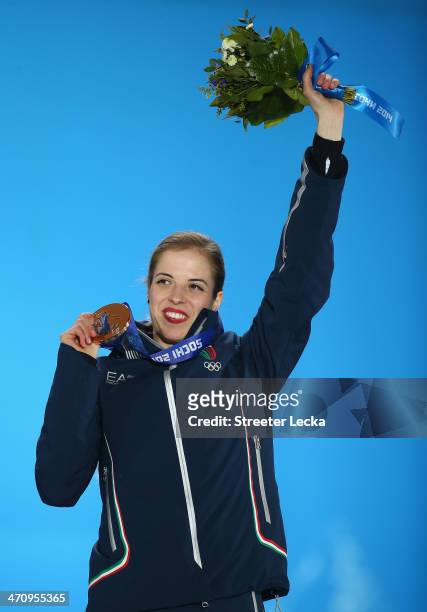 Bronze medalist Carolina Kostner of Italy celebrates during the medal ceremony for the Women's Free Figure Skating on day fourteen of the Sochi 2014...