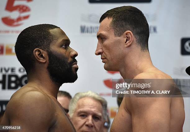 Wladimir Klitschko and Bryant Jennings pose for a face-off after their official weigh-in at Madison Square Garden in New York on April 24, 2015....