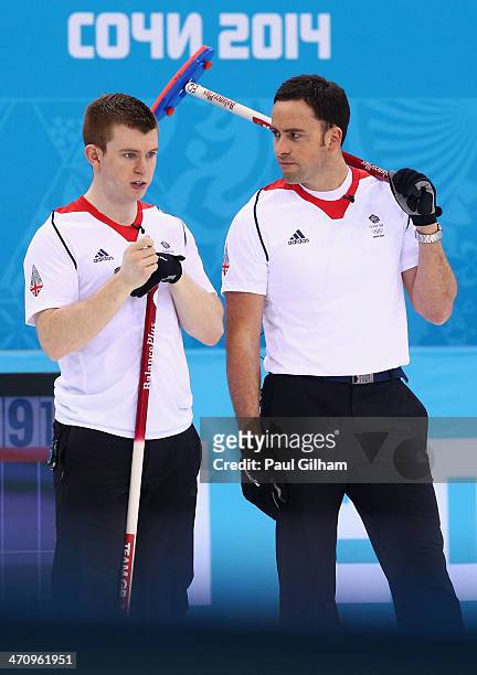 David Murdoch of Great Britain and Greg Drummond look on during the Men's Gold Medal match between Canada and Great Britain on day 14 of the Sochi...