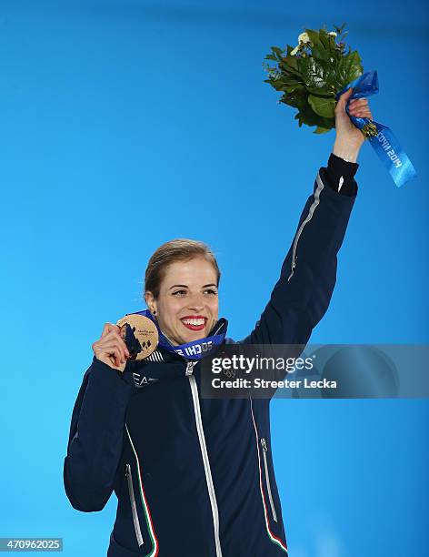 Bronze medalist Carolina Kostner of Italy celebrates during the medal ceremony for the Women's Free Figure Skating on day fourteen of the Sochi 2014...