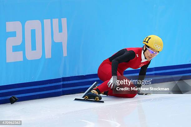 Jianrou Li of China falls while competing in the Short Track Women's 1000m Semifinals on day fourteen of the 2014 Sochi Winter Olympics at Iceberg...