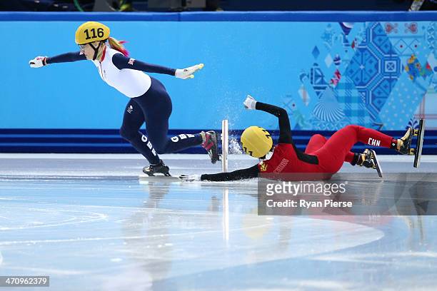 Jianrou Li of China falls while competing in the Short Track Women's 1000m Semifinals on day fourteen of the 2014 Sochi Winter Olympics at Iceberg...