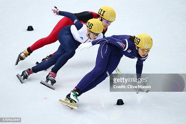 Elise Christie of Great Britain, Jianrou Li of China and Suk Hee Shim of South Korea compete in the Short Track Women's 1000m Semifinals on day...