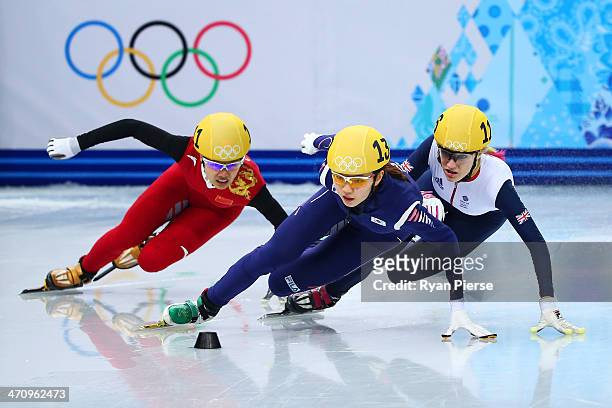 Jianrou Li of China, Suk Hee Shim of South Korea and Elise Christie of Great Britain compete in the Short Track Women's 1000m Semifinals on day...