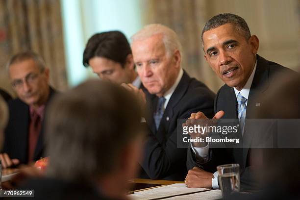 President Barack Obama, right, speaks while meeting with members of the Democratic Governors Association in the State Dining Room of the White House...