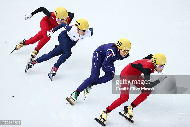 Jianrou Li of China, Elise Christie of Great Britain, Suk Hee Shim of South Korea and Kexin Fan of China compete in the Short Track Women's 1000m...